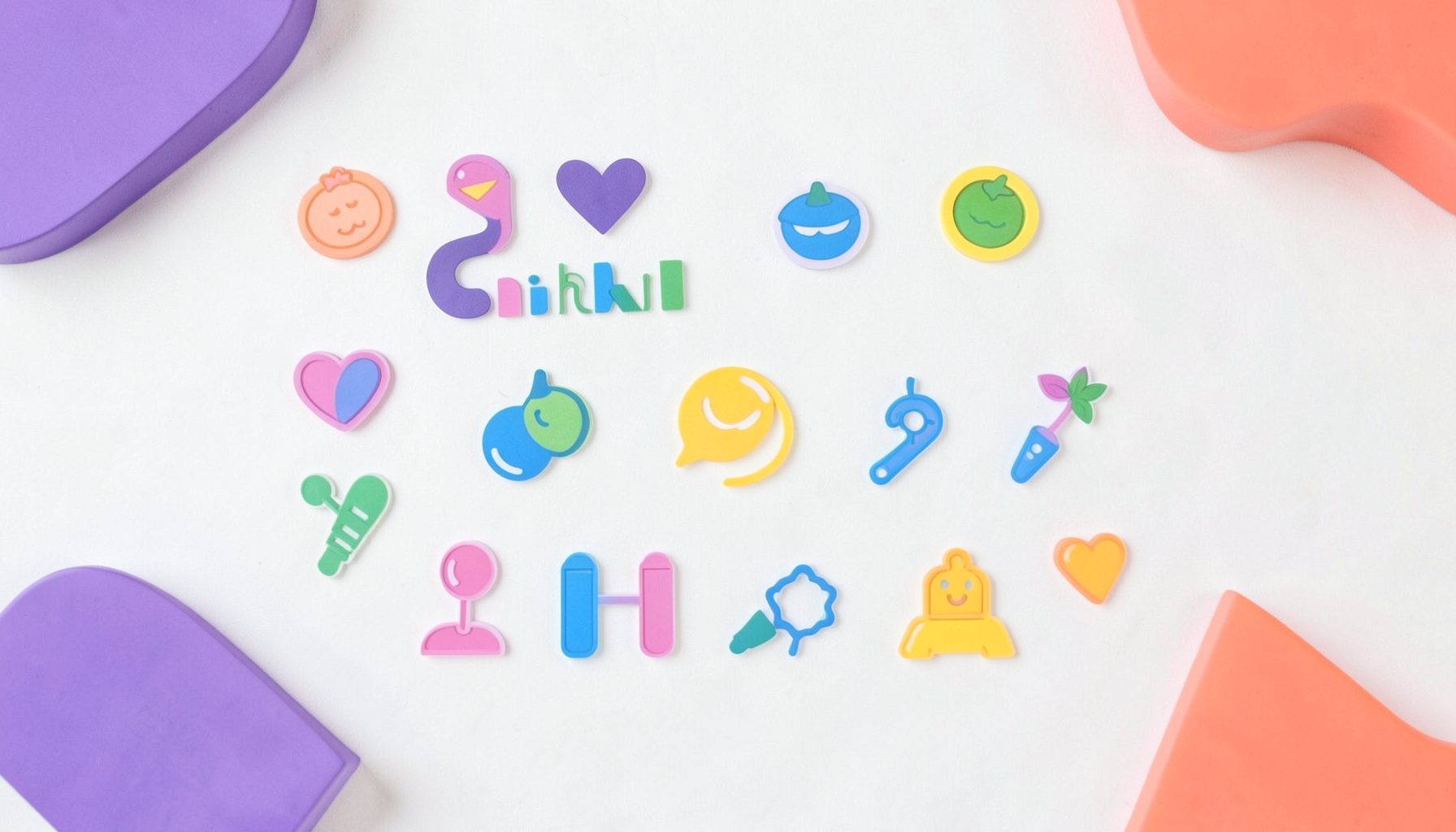 A clean flat-lay arrangement of colorful icon glyphs scattered on a soft white surface, with playful purple and coral accent shapes, giving a bright, organized, design-studio feel