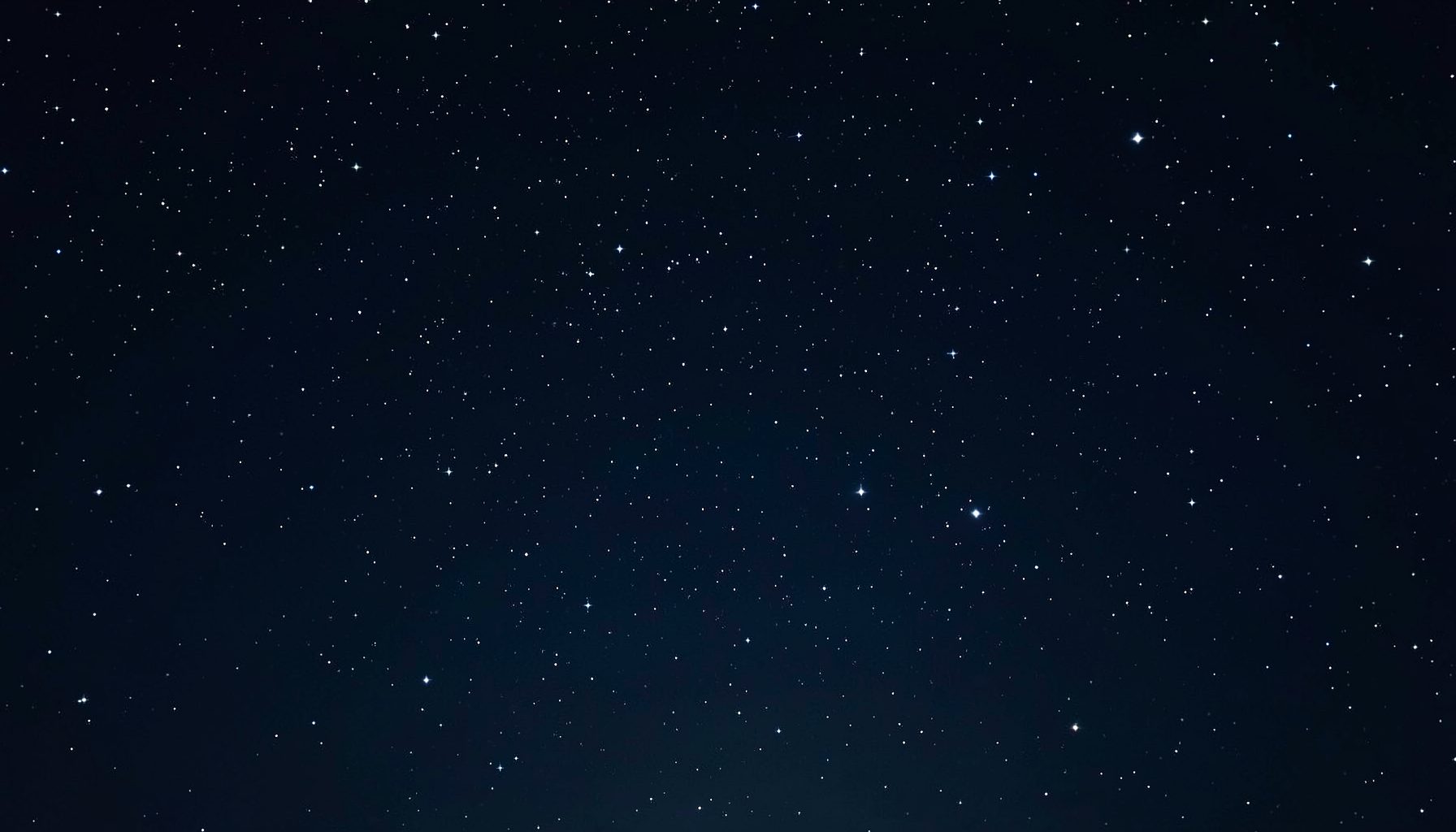 A dark navy starfield background with tiny scattered white stars and a soft glow, calm and quiet in mood